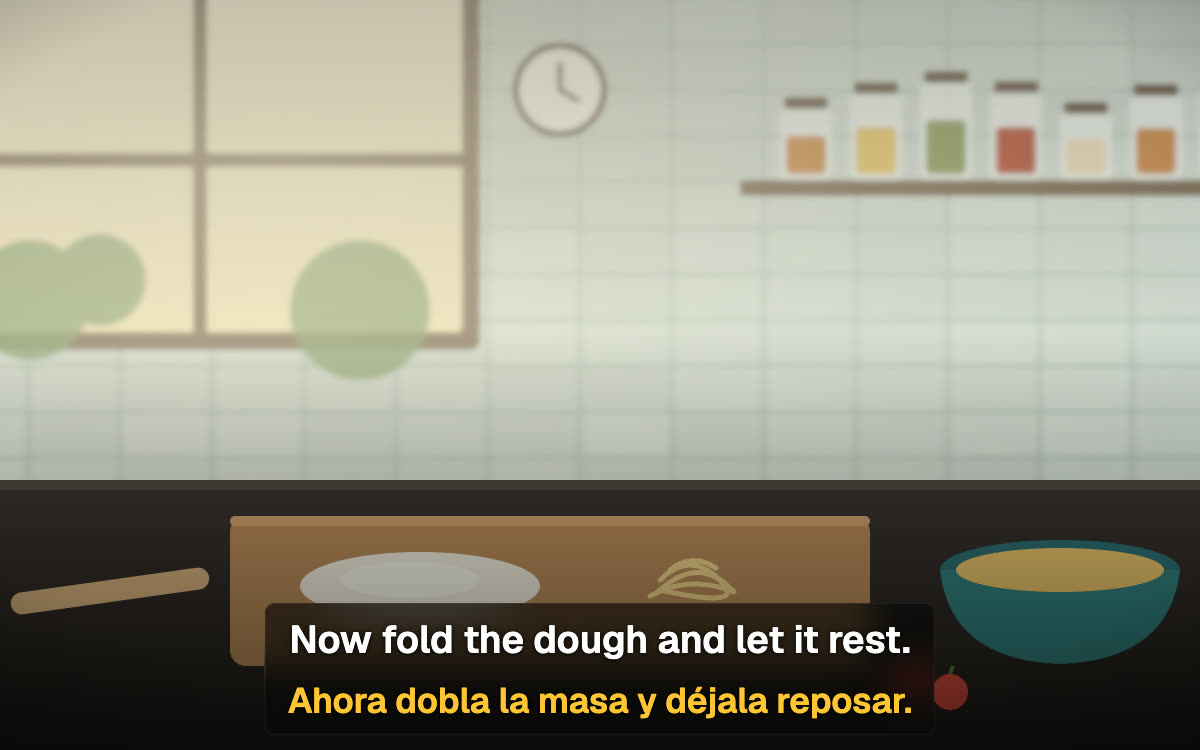 Bir yemek sahnesi üzerinde SubPair'ın gerçek katmanı: İngilizce satır 'Now fold the dough and let it rest.' ve altında İspanyolca 'Ahora dobla la masa y déjala reposar.'